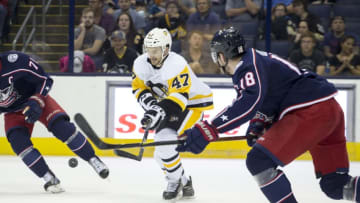 COLUMBUS, OH - SEPTEMBER 22: Adam Johnson #47 of the Pittsburgh Penguins try to control the puck while its in the air during the first period of the preseason game between the Columbus Blue Jackets and the Pittsburgh Penguins on September 22, 2017 at Nationwide Arena in Columbus, Ohio. (Photo by Jason Mowry/Icon Sportswire via Getty Images)
