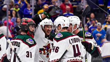 Nov 16, 2021; St. Louis, Missouri, USA; Arizona Coyotes center Jay Beagle (83) and goaltender Scott Wedgewood (31) and defenseman Ilya Lyubushkin (46) and left wing Lawson Crouse (67) celebrate after defeating the St. Louis Blues at Enterprise Center. Mandatory Credit: Jeff Curry-USA TODAY Sports