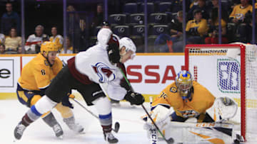NASHVILLE, TN - FEBRUARY 23: Nashville Predators center Kyle Turris (8) defends as goalie Pekka Rinne (35) makes a save on Colorado Avalanche right wing Matt Calvert (11) during the NHL game between the Nashville Predators and Colorado Avalanche, held on February 23, 2019, at Bridgestone Arena in Nashville, Tennessee. (Photo by Danny Murphy/Icon Sportswire via Getty Images)