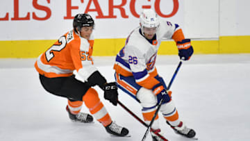 Sep 28, 2021; Philadelphia, Pennsylvania, USA; Philadelphia Flyers right wing Tyson Foerster (52) battles for the puck against New York Islanders right wing Oliver Wahlstrom (26) during the third period at Wells Fargo Center. Mandatory Credit: Eric Hartline-USA TODAY Sports
