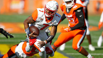 Feb 5, 2022; Mobile, AL, USA; American squad quarterback Malik Willis of Liberty (7) is sacked by National Squad defensive lineman Haskell Garrett of Ohio State (93) in the first half at Hancock Whitney Stadium. Mandatory Credit: Nathan Ray Seebeck-USA TODAY Sports
