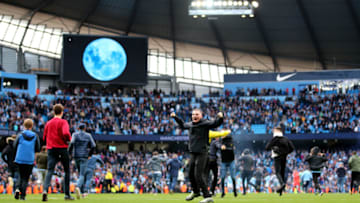 MANCHESTER, ENGLAND - APRIL 22: Fans invade the pitch following the Premier League match between Manchester City and Swansea City at Etihad Stadium on April 22, 2018 in Manchester, England. (Photo by Clive Brunskill/Getty Images)