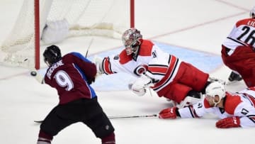 Oct 21, 2015; Denver, CO, USA; Carolina Hurricanes goalie Cam Ward (30) makes a last second stick save on a shot attempt by Colorado Avalanche center Matt Duchene (9) in the third period at Pepsi Center. The Hurricanes defeated the Avalanche in overtime 1-0. Mandatory Credit: Ron Chenoy-USA TODAY Sports
