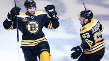 May 1, 2014; Boston, MA, USA; Boston Bruins left wing Brad Marchand (63) celebrates with defenseman Johnny Boychuk (55) after he scored a goal to tie the game during the third period against the Montreal Canadiens in game one of the second round of the 2014 Stanley Cup Playoffs at TD Banknorth Garden. Mandatory Credit: Greg M. Cooper-USA TODAY Sports