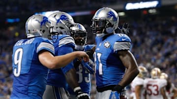 Dec 27, 2015; Detroit, Detroit Lions wide receiver Calvin Johnson (81) celebrates with teammates including quarterback Matthew Stafford (9) after a touchdown reception during the fourth quarter against the San Francisco 49ers at Ford Field. Lions win 32-17. Mandatory Credit: Raj Mehta-USA TODAY Sports