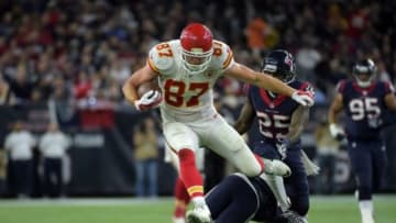 Jan 9, 2016; Houston, TX, USA; Kansas City Chiefs tight end Travis Kelce (87) leaps over Houston Texans cornerback Johnathan Joseph (24) in the third quarter in a AFC Wild Card playoff football game at NRG Stadium. Mandatory Credit: Kirby Lee-USA TODAY Sports