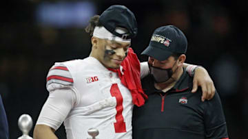 Ohio State Buckeyes head coach Ryan Day and quarterback Justin Fields (1) share a moment after Fields was awarded the Most Outstanding Player award after beating Clemson Tigers 49-28 in the College Football Playoff semifinal at the Allstate Sugar Bowl in the Mercedes-Benz Superdome in New Orleans on Friday, Jan. 1, 2021.College Football Playoff Ohio State Faces Clemson In Sugar Bowl