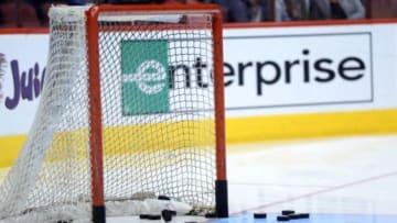 Jan 6, 2015; Glendale, AZ, USA; Pucks lie in the crease and net before the game between the Arizona Coyotes and the St. Louis Blues at Gila River Arena. The Blues won 6-0. Mandatory Credit: Joe Camporeale-USA TODAY Sports