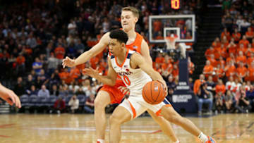CHARLOTTESVILLE, VA - JANUARY 11: Kihei Clark #0 of the Virginia Cavaliers drives past Buddy Boeheim #35 of the Syracuse Orange in the second half during a game at John Paul Jones Arena on January 11, 2020 in Charlottesville, Virginia. (Photo by Ryan M. Kelly/Getty Images)