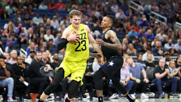 Mar 9, 2023; Orlando, Florida, USA; Utah Jazz forward Lauri Markkanen (23) drives to the hope past Orlando Magic guard Markelle Fultz (20) in the fourth quarter at Amway Center. Mandatory Credit: Nathan Ray Seebeck-USA TODAY Sports