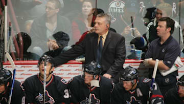 VANCOUVER, BC - SEPTEMBER 30: Assistant coach Mike Kelly of the Vancouver Canucks looks on against the Edmonton Oilers during their preseason game at General Motors Place on September 30, 2006 in Vancouver, British Columbia, Canada. The Oilers won 3-2. (Photo by Jeff Vinnick/Getty Images)