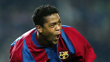 Barcelona's Dutch Patrick Kluivert screams 18 February, 2003 after scoring the third for his team during their Champions League match group A in Camp Nou stadium of Barcelona. Barcelona won 3-0. AFP PHOTO/ JAVIER SORIANO. (Photo by Javier SORIANO / AFP) (Photo by JAVIER SORIANO/AFP via Getty Images)