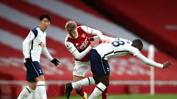 LONDON, ENGLAND - MARCH 14: Martin Odegaard of Arsenal battles for possession with Tanguy Ndombele of Tottenham Hotspur during the Premier League match between Arsenal and Tottenham Hotspur at Emirates Stadium on March 14, 2021 in London, England. (Photo by Nick Potts - Pool/Getty Images)