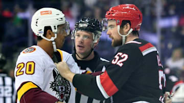 ROSEMONT, IL - DECEMBER 02: Grand Rapids Griffins defenseman Dylan McIlrath (52) and Chicago Wolves right wing Keegan Kolesar (20) fight during the game between the Chicago Wolves and the Grand Rapids Griffins on December 2, 2017 at the Allstate Arena in Rosemont, Illinois. (Photo by Quinn Harris/Icon Sportswire via Getty Images)