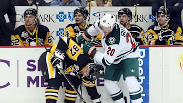 Nov 10, 2016; Pittsburgh, PA, USA; Minnesota Wild defenseman Ryan Suter (20) checks Pittsburgh Penguins center Sidney Crosby (87) during the second period at the PPG Paints Arena. Mandatory Credit: Charles LeClaire-USA TODAY Sports