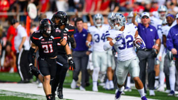 LUBBOCK, TX - NOVEMBER 4: Justin Silmon #32 of the Kansas State Wildcats breaks away for a big gain against the Texas Tech Red Raiders defense during the first half of the game on November 4, 2017 at Jones AT&T Stadium in Lubbock, Texas. (Photo by John Weast/Getty Images)