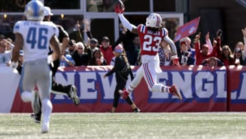 FOXBOROUGH, MASSACHUSETTS - OCTOBER 09: Kyle Dugger #23 of the New England Patriots celebrates after returning a fumble for a touchdown during the second quarter against the Detroit Lions at Gillette Stadium on October 09, 2022 in Foxborough, Massachusetts. (Photo by Nick Grace/Getty Images)