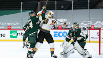Mar 8, 2021; Saint Paul, Minnesota, USA; Minnesota Wild defenseman Matt Dumba (24) and Vegas Golden Knights left wing Max Pacioretty (67) compete while Minnesota Wild goaltender Kaapo Kahkonen (34) defends his net in the third period at Xcel Energy Center. Mandatory Credit: David Berding-USA TODAY Sports