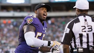 Aug 22, 2015; Philadelphia, PA, USA; Baltimore Ravens outside linebacker Terrell Suggs (55) argues his penalty with referee Jerome Boger (23) during the first quarter against the Philadelphia Eagles at Lincoln Financial Field. Mandatory Credit: Bill Streicher-USA TODAY Sports