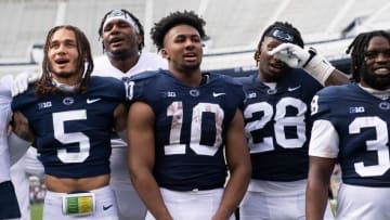 Penn State running back Nick Singleton (10) joins in with his teammates as they sing the alma mater following the Blue-White game at Beaver Stadium on Saturday, April 15, 2023, in State College.230415 Hes Dr Bluewhite
