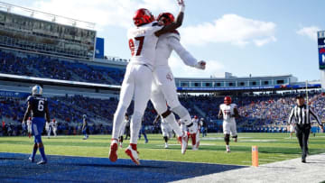 LEXINGTON, KY - NOVEMBER 25: Dez Fitzpatrick #87 and Malik Williams #29 of the Louisville Cardinals celebrate after Fitzpatrick caught a touchdown pass against the Kentucky Wildcats during the game at Commonwealth Stadium on November 25, 2017 in Lexington, Kentucky. (Photo by Andy Lyons/Getty Images)
