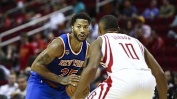 Oct 4, 2016; Houston, TX, USA; New York Knicks guard Derrick Rose (25) controls the ball as Houston Rockets guard Eric Gordon (10) defends during the third quarter at Toyota Center. The Rockets won 130-103. Mandatory Credit: Troy Taormina-USA TODAY Sports