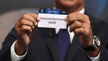 Netherlands' former striker Ruud Gullit shows the name of Borussia Dortmund during the draw for the round of 16 of the UEFA Champions League football tournament at the UEFA headquarters in Nyon on December 12, 2016. / AFP / Fabrice COFFRINI (Photo credit should read FABRICE COFFRINI/AFP/Getty Images)