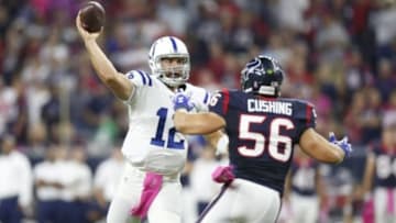 Oct 9, 2014; Houston, TX, USA; Indianapolis Colts quarterback Andrew Luck (12) throws in the pocket against Houston Texans linebacker linebacker Brian Cushing (56) at NRG Stadium. Mandatory Credit: Matthew Emmons-USA TODAY Sports