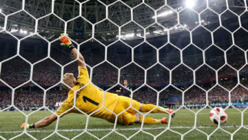 NIZHNY NOVGOROD, RUSSIA - JULY 01: Luka Modric of Croatia scores past Kasper Schmeichel of Denmark his team's third penalty in the penalty shoot out during the 2018 FIFA World Cup Russia Round of 16 match between Croatia and Denmark at Nizhny Novgorod Stadium on July 1, 2018 in Nizhny Novgorod, Russia. (Photo by Francois Nel/Getty Images)
