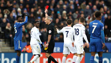 LEICESTER, ENGLAND - DECEMBER 16: Wilfred Ndidi of Leicester City is shown a red card by referee Martin Atkinson during the Premier League match between Leicester City and Crystal Palace at The King Power Stadium on December 16, 2017 in Leicester, England. (Photo by Matthew Lewis/Getty Images)