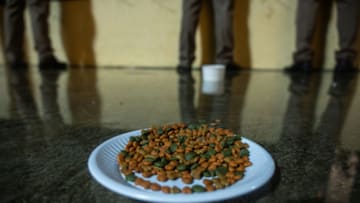 HAT YAI, THAILAND - NOVEMBER 30: A plate of dog food is left on the floor as a symbolic gesture to mock the police during the protest at Hat Yai Clock Tower on November 30, 2020 in Hat Yai, Thailand. Protesters held a rally in Thailand's deep South, a region that has traditionally been a royalist stronghold, as tensions between pro-democracy and pro-establishment forces escalate across the country. (Photo by Sirachai Arunrugstichai/Getty Images)