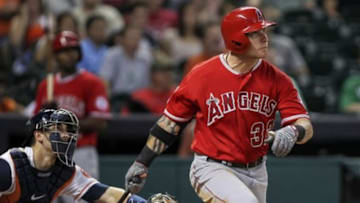 Jun 3, 2014; Houston, TX, USA; Los Angeles Angels left fielder Josh Hamilton (32) hits a home run during the eighth inning against the Houston Astros at Minute Maid Park. Mandatory Credit: Troy Taormina-USA TODAY Sports