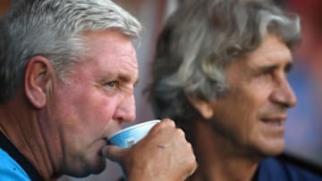 WALSALL, ENGLAND - JULY 25: Aston Villa manager Steve Bruce (l) with West Ham manager Manuel Pellegrini during a friendly match between Aston Villa and West Ham United at Banks' Stadium on July 25, 2018 in Walsall, England. (Photo by Stu Forster/Getty Images)