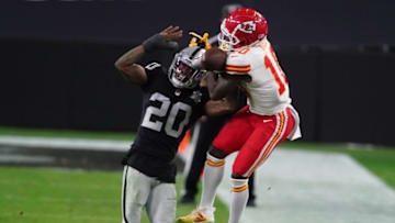 Nov 22, 2020; Paradise, Nevada, USA; Las Vegas Raiders cornerback Damon Arnette (20) breaks up a pass intended for Kansas City Chiefs wide receiver Tyreek Hill (10) during the second half at Allegiant Stadium. Mandatory Credit: Kirby Lee-USA TODAY Sports