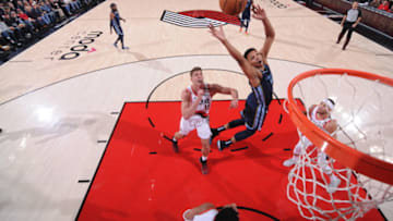 PORTLAND, OR - DECEMBER 19: Ivan Rabb #10 of the Memphis Grizzlies rebounds the ball against the Portland Trail Blazers on December 19 , 2018 at the Moda Center Arena in Portland, Oregon. NOTE TO USER: User expressly acknowledges and agrees that, by downloading and or using this photograph, user is consenting to the terms and conditions of the Getty Images License Agreement. Mandatory Copyright Notice: Copyright 2018 NBAE (Photo by Sam Forencich/NBAE via Getty Images)