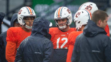 Auburn football quarterbacks huddle up during the A-Day spring football game at Jordan-Hare Stadium in Auburn, Ala., on Saturday, April 8, 2023.