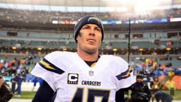 Jan 5, 2014; Cincinnati, OH, USA; San Diego Chargers quarterback Philip Rivers (17) exits the field after defeating the Cincinnati Bengals 27-10 to win AFC wild card playoff football game at Paul Brown Stadium. Mandatory Credit: Andrew Weber-USA TODAY Sports
