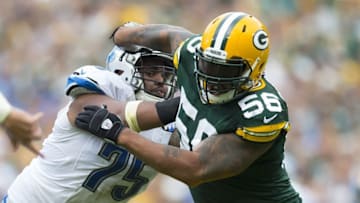 Sep 25, 2016; Green Bay, WI, USA; Green Bay Packers linebacker Julius Peppers (56) rushes around Detroit Lions guard Larry Warford (75) during the fourth quarter at Lambeau Field. Green Bay won 34-27. Mandatory Credit: Jeff Hanisch-USA TODAY Sports