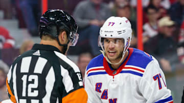 OTTAWA, ON - OCTOBER 5: Tony DeAngelo #77 of the New York Rangers has words with referee Justin St. Pierre #12 after a scrum in a game the Ottawa Senators at Canadian Tire Centre on October 5, 2019 in Ottawa, Ontario, Canada. (Photo by Jana Chytilova/Freestyle Photography/Getty Images)