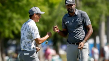AVONDALE, LOUISIANA - APRIL 20: Justin Suh of the United States and Sahith Theegala of the United States react on the first green after a putt during the first round of the Zurich Classic of New Orleans at TPC Louisiana on April 20, 2023 in Avondale, Louisiana. (Photo by Sean Gardner/Getty Images)