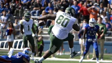 Oct 10, 2015; Lawrence, KS, USA; BBaylor Bears tight end LaQuan McGowan (80) scores a touchdown after catching a pass against Kansas Jayhawks safety Michael Glatczak (39) in the first half at Memorial Stadium. Mandatory Credit: John Rieger-USA TODAY Sports