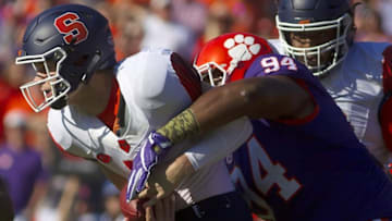 Nov 5, 2016; Clemson, SC, USA; Syracuse Orange quarterback Eric Dungey (2) is sacked by Clemson Tigers defensive tackle Carlos Watkins (94) during the first quarter at Clemson Memorial Stadium. Mandatory Credit: Joshua S. Kelly-USA TODAY Sports