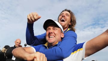 PARIS, FRANCE - SEPTEMBER 30: Ian Poulter and Tommy Fleetwood of Europe celebrate winning the Ryder Cup during singles matches of the 2018 Ryder Cup at Le Golf National on September 30, 2018 in Paris, France. (Photo by Richard Heathcote/Getty Images)