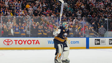 BUFFALO, NY - NOVEMBER 23: Carter Hutton #40 of the Buffalo Sabres celebrates their 3-2 overtime victory against the Montreal Canadiens in an NHL game on November 23, 2018 at KeyBank Center in Buffalo, New York. (Photo by Stephanie Wippert/NHLI via Getty Images)