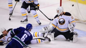 Jan 30, 2015; Vancouver, British Columbia, CAN; Vancouver Canucks defenseman Yannick Weber (6) scores against Buffalo Sabres goaltender Matt Hackett (31) during the second period at Rogers Arena. Mandatory Credit: Anne-Marie Sorvin-USA TODAY Sports