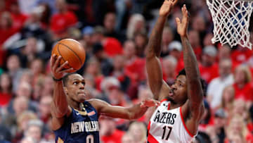 PORTLAND, OR - APRIL 17: Rajon Rondo #9 of the New Orleans Pelicans drives against Ed Davis #17 of the Portland Trail Blazers during Game One of the Western Conference Quarterfinals during the 2018 NBA Playoffs at Moda Center on April 17, 2018 in Portland, Oregon. NOTE TO USER: User expressly acknowledges and agrees that, by downloading and or using this photograph, User is consenting to the terms and conditions of the Getty Images License Agreement. (Photo by Jonathan Ferrey/Getty Images)