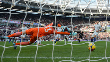 LONDON, ENGLAND - DECEMBER 09: Marko Arnautovic of West Ham United (obscure) scores his sides first goal past Thibaut Courtois of Chelsea during the Premier League match between West Ham United and Chelsea at London Stadium on December 9, 2017 in London, England. (Photo by Dan Mullan/Getty Images)