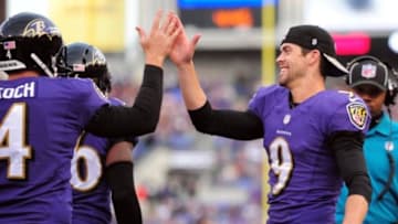 Nov 9, 2014; Baltimore, MD, USA; Baltimore Ravens kicker Justin Tucker (9) high fives punter Sam Koch (4) in the fourth quarter against the Tennessee Titans at M&T Bank Stadium. Mandatory Credit: Evan Habeeb-USA TODAY Sports