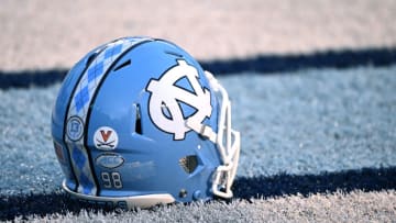 CHAPEL HILL, NORTH CAROLINA - NOVEMBER 19: A detailed view of a University of Virginia helmet sticker, in honor of the three Virginia football players who were killed in a shooting, is seen on the helmet of a North Carolina Tar Heels player during their game against the Georgia Tech Yellow Jackets at Kenan Memorial Stadium on November 19, 2022 in Chapel Hill, North Carolina. (Photo by Grant Halverson/Getty Images)
