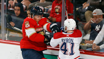 SUNRISE, FL - MARCH 29: Ben Chiarot #8 of the Florida Panthers and Paul Byron #41 of the Montreal Canadiens battle behind the net during first-period action at the FLA Live Arena on March 29, 2022 in Sunrise, Florida. (Photo by Joel Auerbach/Getty Images)